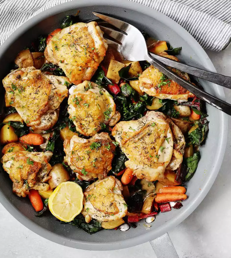 Skillet Chicken Thighs with Potatoes, Carrots, and Greens